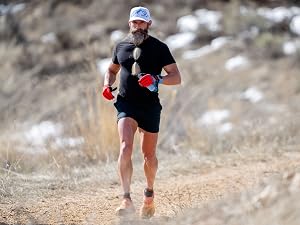 Athlete running on a trail fueled by Re-Lyte Hydration for endurance and performance support.