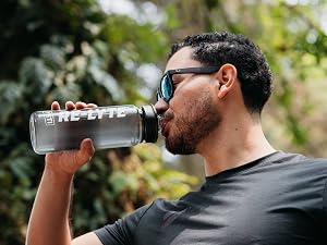 Man drinking Re-Lyte Energy from his water bottle for clean, no-sugar Energy support