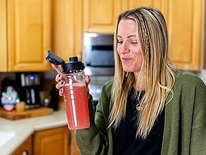 Woman drinking Re-Lyte Hydration for clean, no-sugar immune support.